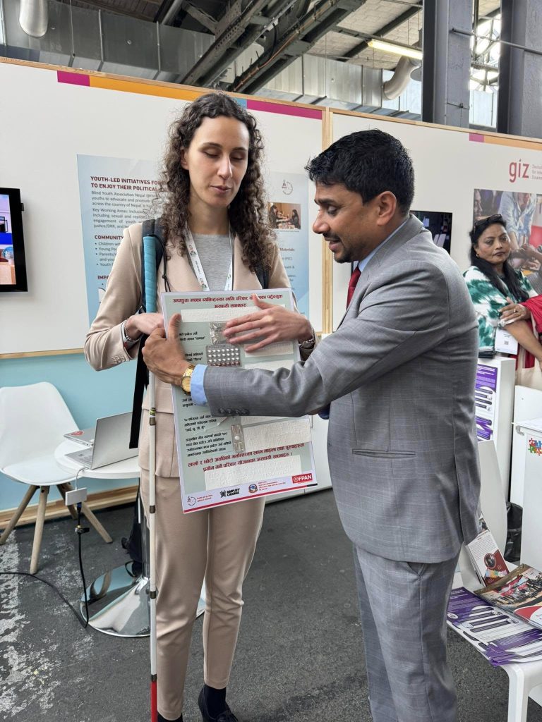 Our President, Mr. Ram Chandra Gaihre sir, President demonstrates temporary family planning methods using FP boards to individuals with visual impairments at the Global Disability Summit 2025.